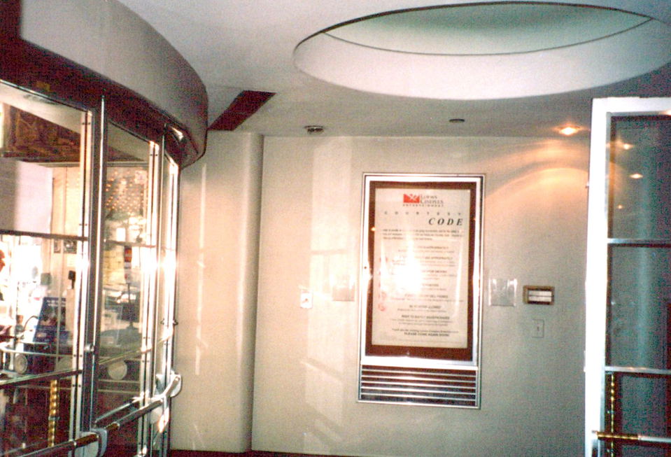 Esquire (Oak Street) features a prominent glass revolving door at its entrance.