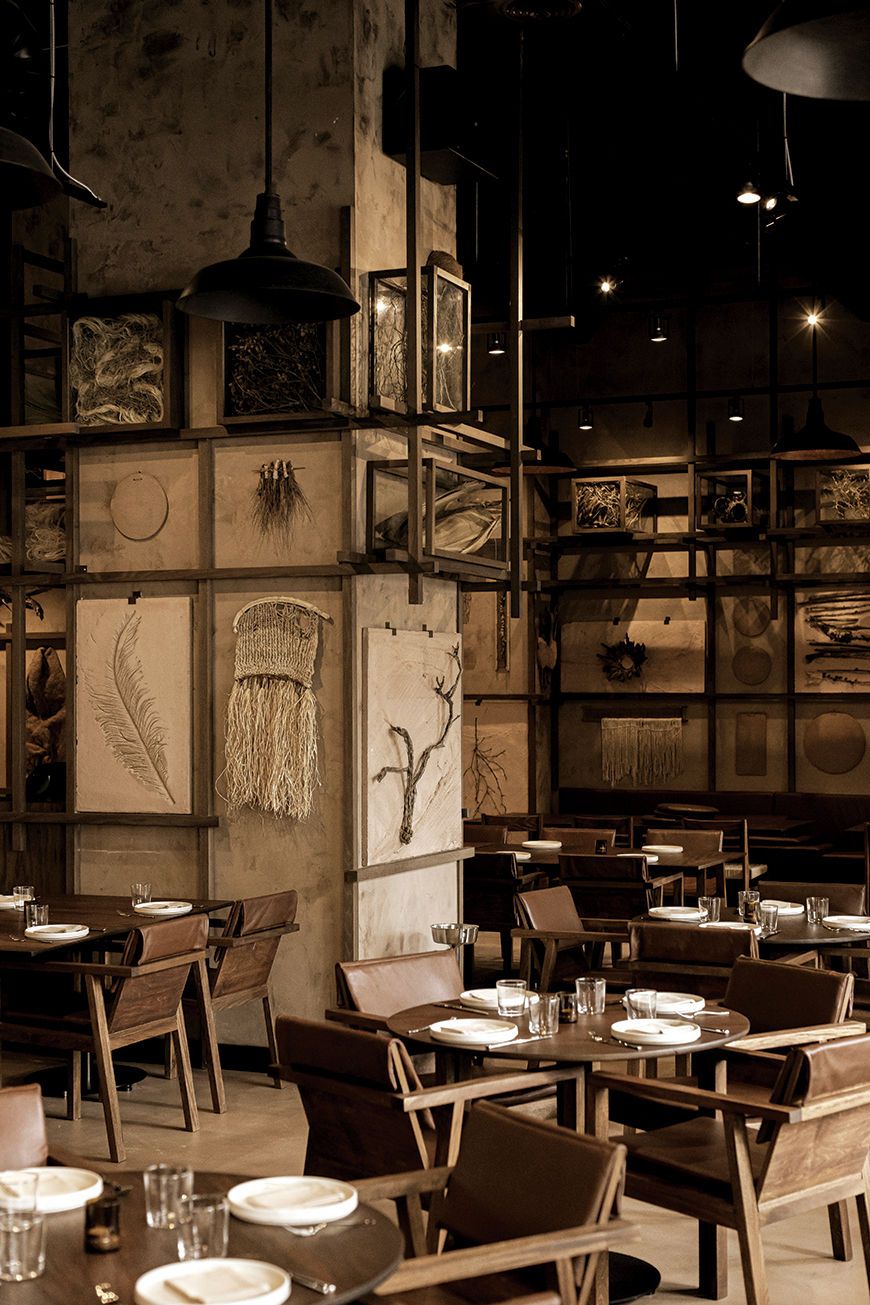 Otto’s (Damen Avenue) features a sophisticated interior defined by its rich, dark earthy color palette.