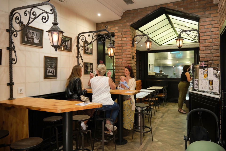 Unnamed Basque Taberna (West Town) features ornate wrought iron lanterns casting a warm glow.