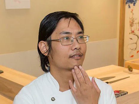 Otto's chef stands pensively before the U-shaped omakase counter, ready for summer 2026 openings.