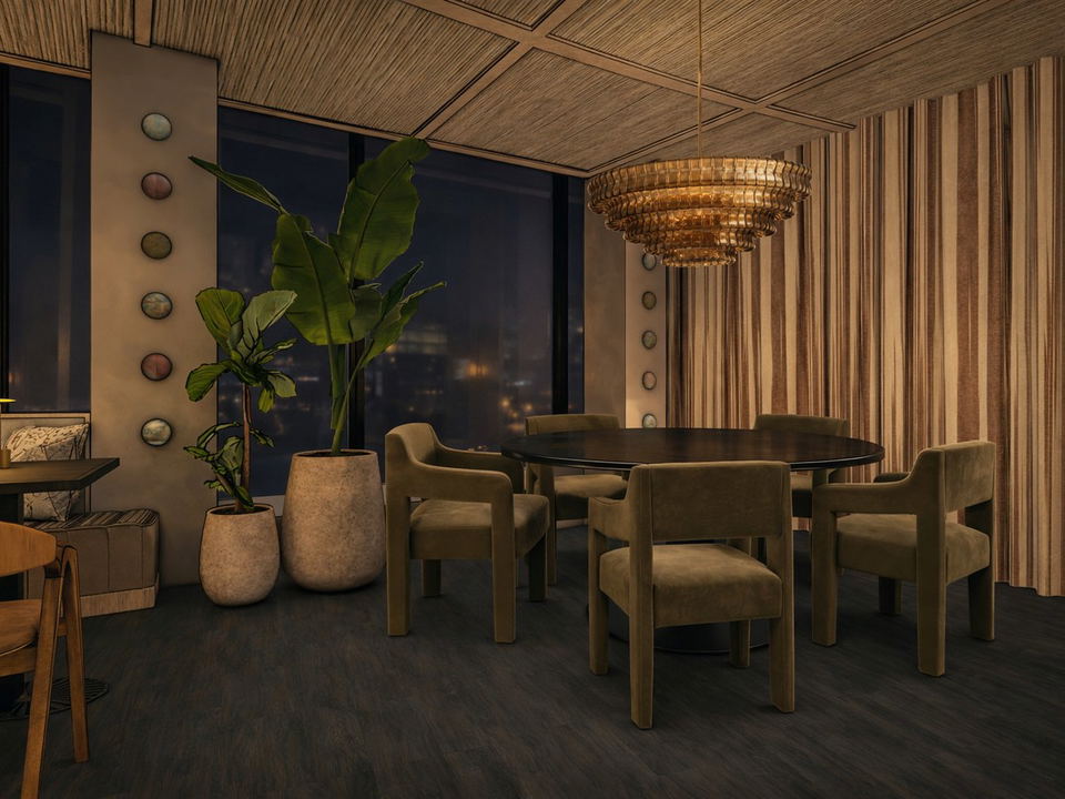 An upscale restaurant dining room interior at night with a round dark table, olive-green velvet armchairs, and a tiered amber glass chandelier.