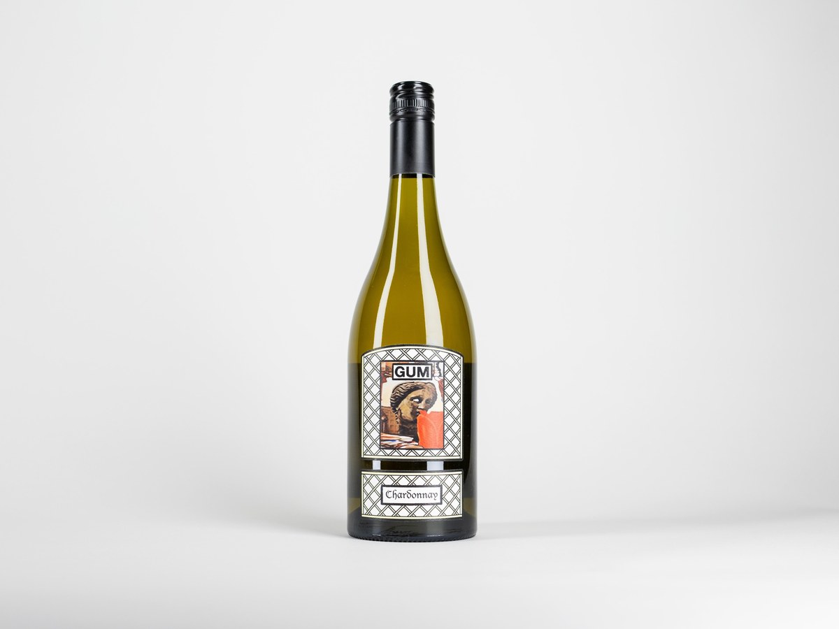 A GUM Chardonnay wine bottle, featuring a distinctive label with 'GUM' and 'Chardonnay' text, stands on a white background.
