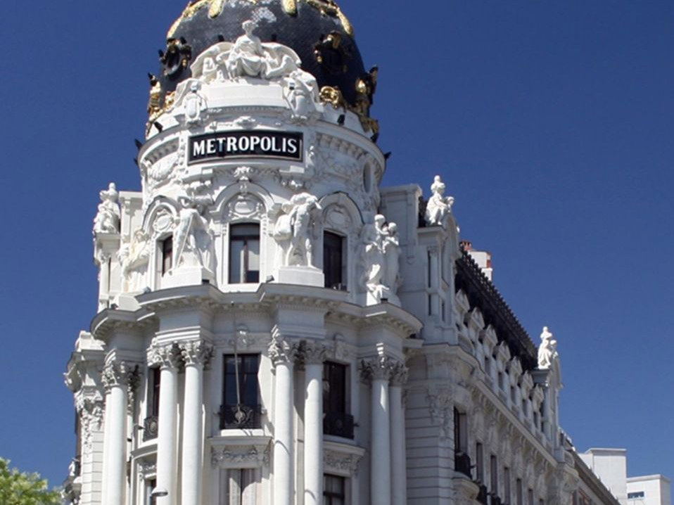 club metrópolis madrid's ornate Beaux-Arts dome and facade, showcasing its intricate restoration.