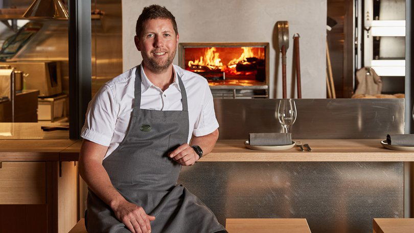 Cote Basque Melbourne's head chef Allan Doert Eccles in his kitchen with a wood-fired oven.