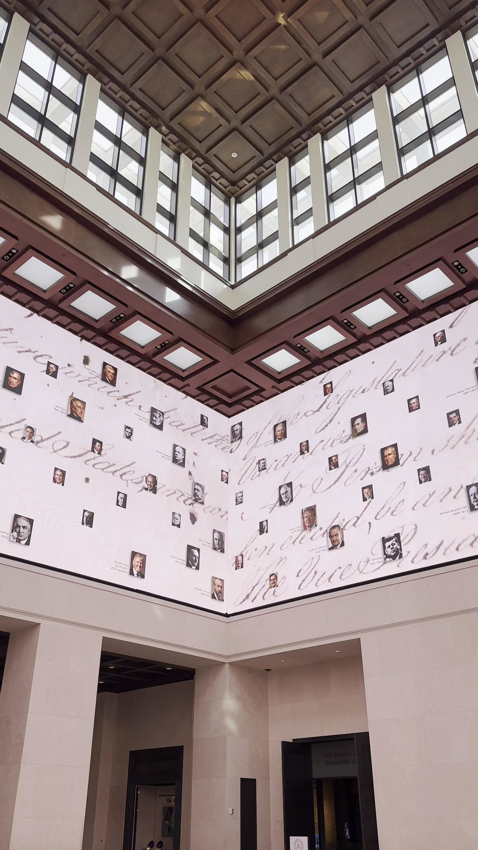 Planning Your Visit from the US, note the many small portraits displayed across the illuminated walls.