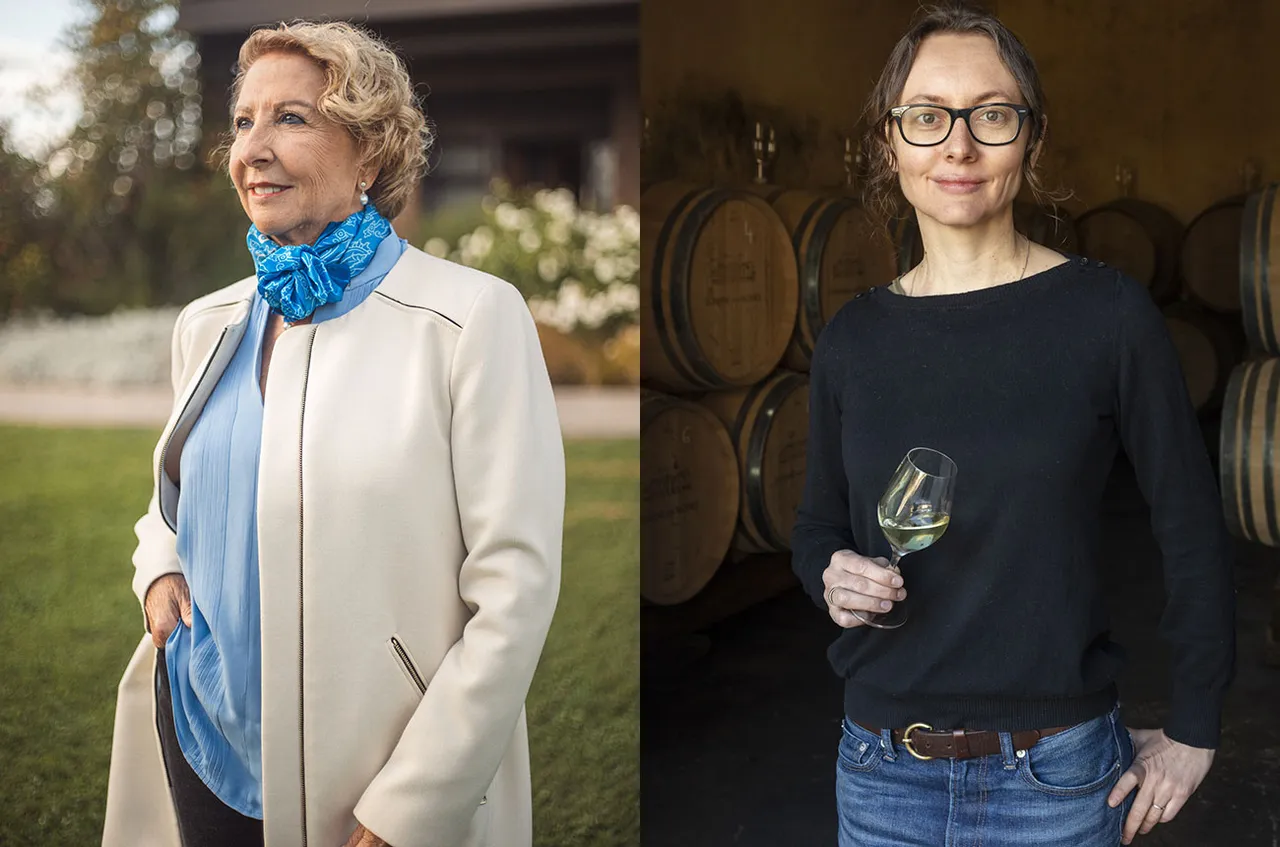 Side-by-side portraits of two women, one wearing a cream blazer with blue scarf in an outdoor garden setting, and one wearing a black sweater holding a wine glass in front of wooden barrels.
