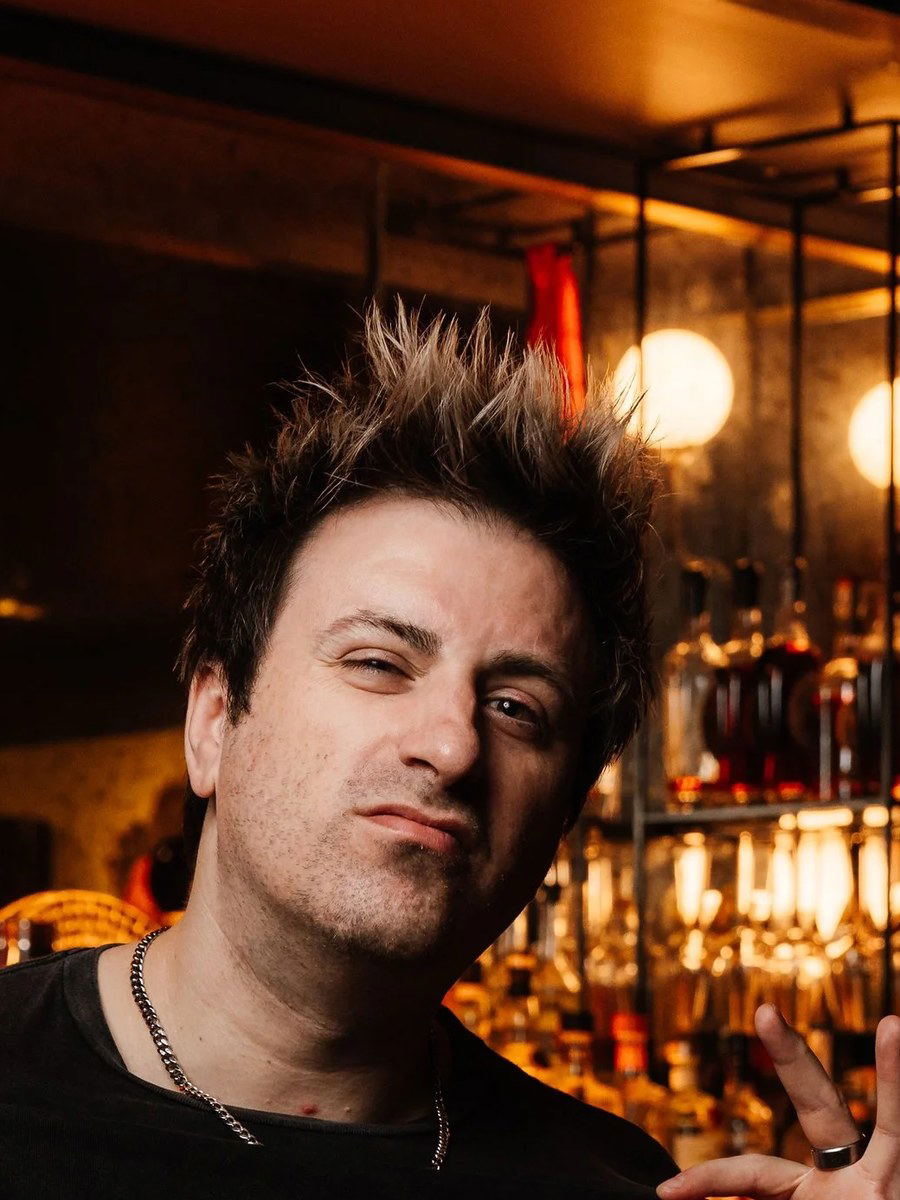 Deke Dunne, formerly of Allegory, poses in a bar setting.