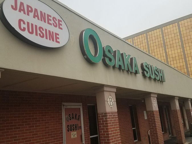 Exterior view of Osaka Sushi in Belcaro, showing the storefront with signs for "OSAKA SUSHI" and "JAPANESE CUISINE."