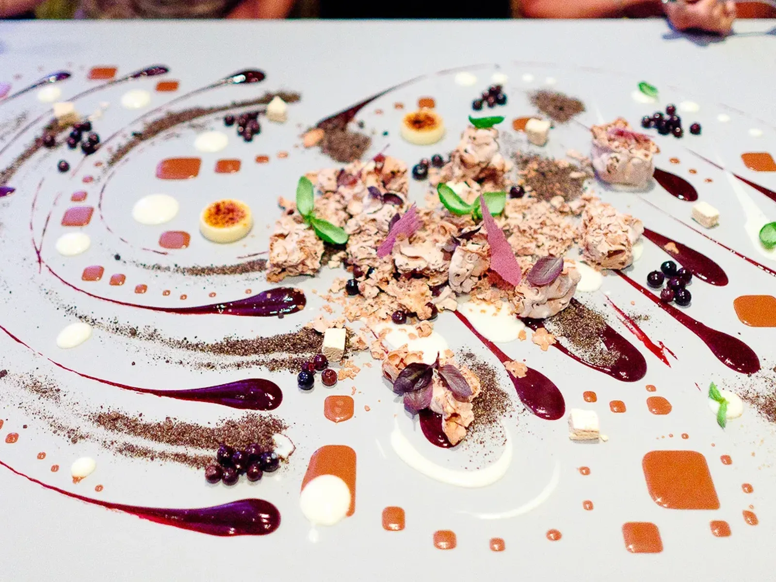 A deconstructed dessert presentation, embodying the theatricality of Alinea Restaurant.
