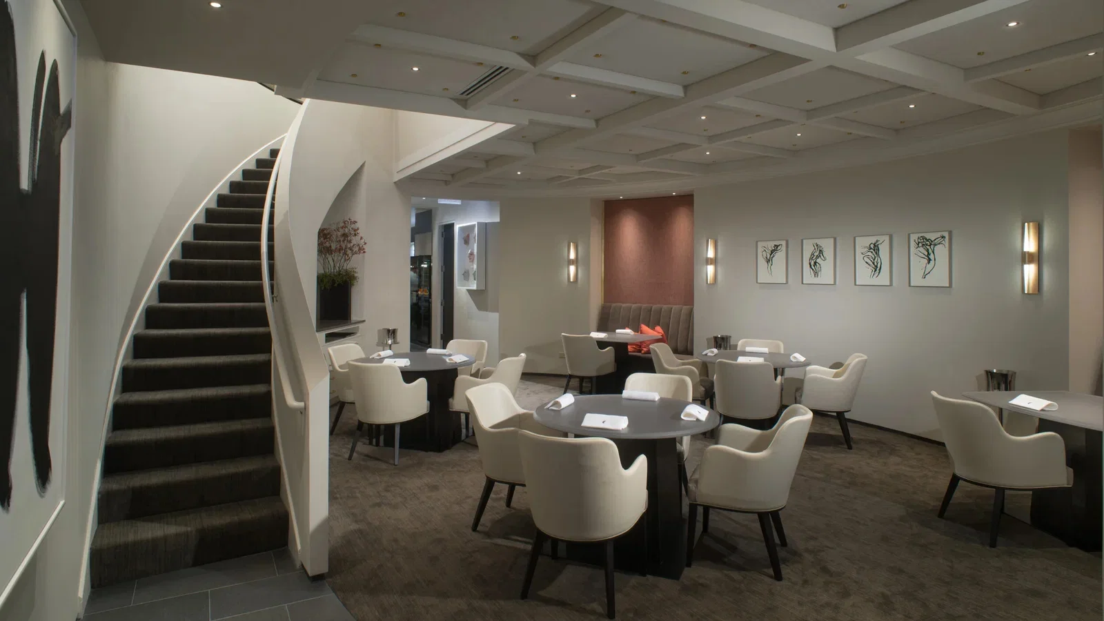 Alinea's Future in Fine Dining features a striking curved staircase leading to the upper level.