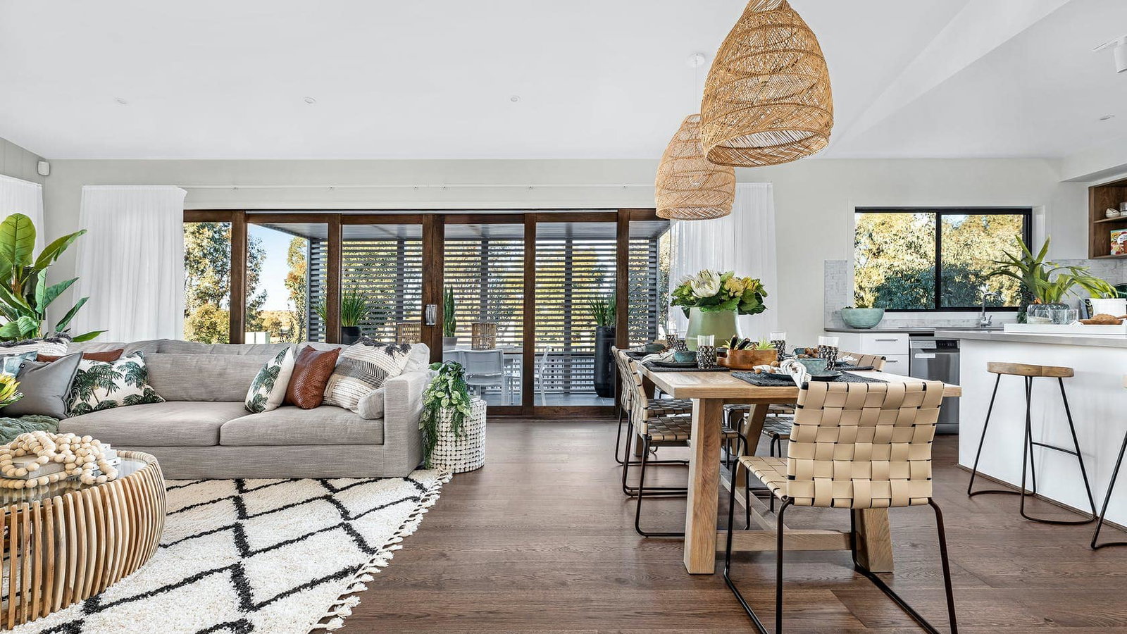 Dining Room vs. Lounge Options, showcasing natural woven textures in the lighting and seating.