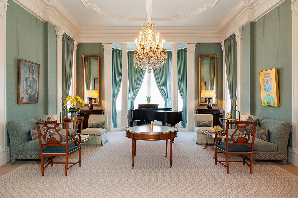 Planning Your Visit, the room features striking teal walls and matching drapes, creating a serene ambiance.