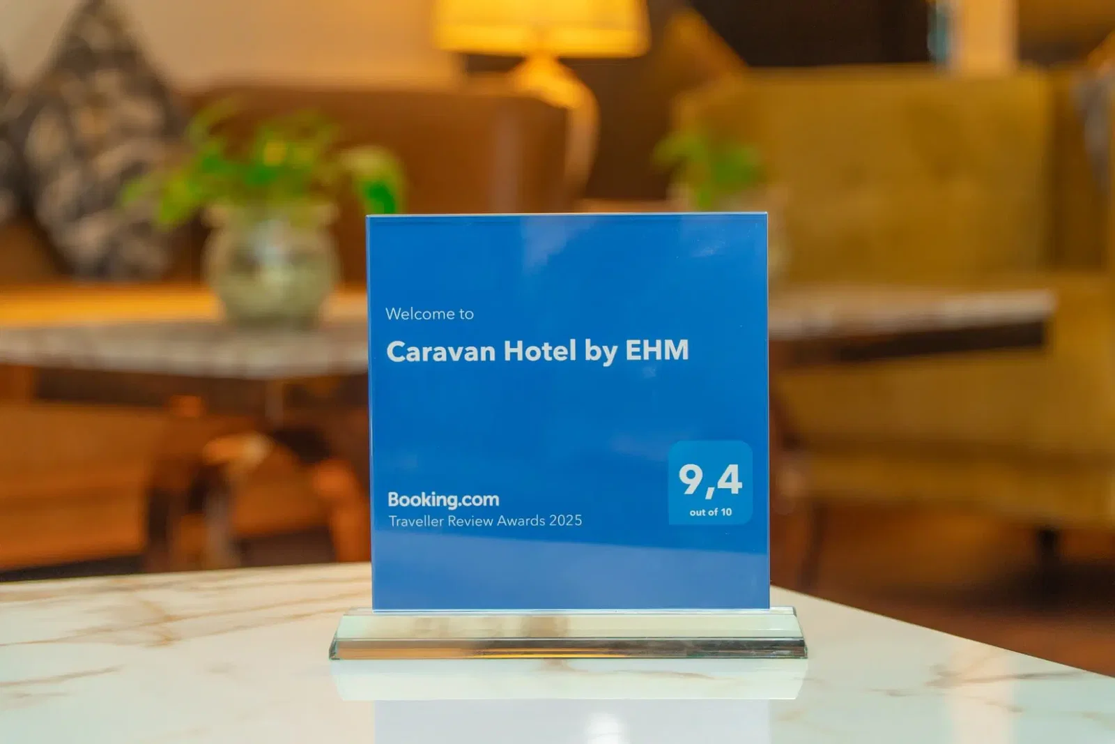 Awards and Guest Ratings highlight a blue plaque displaying a 9.4 out of 10 rating.