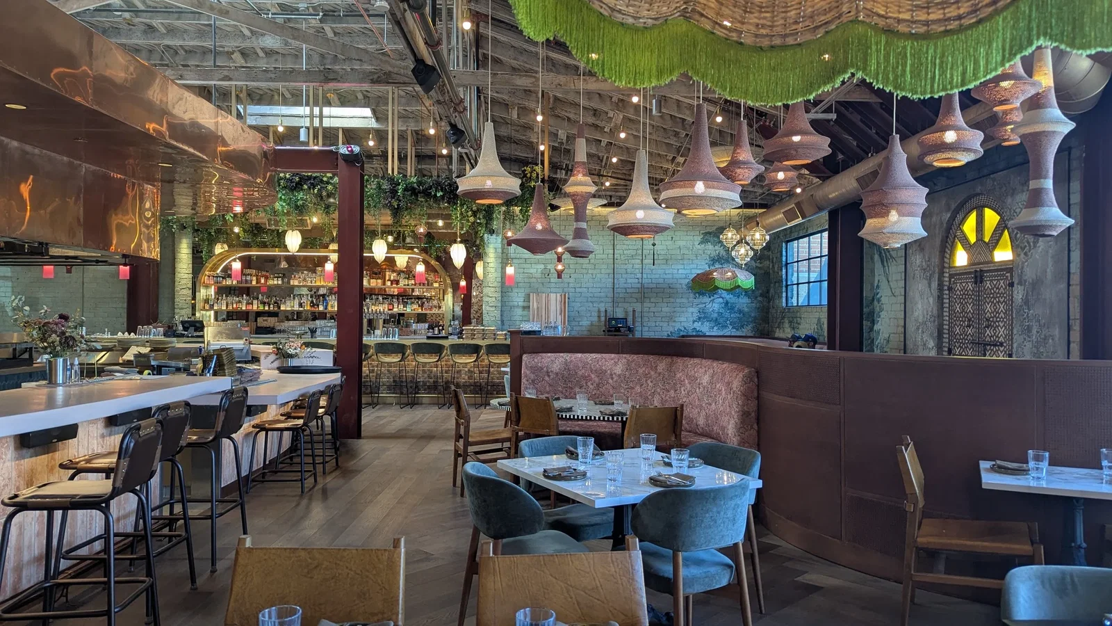 Menu and Dining Options features numerous unique woven pendant lights illuminating the dining area.
