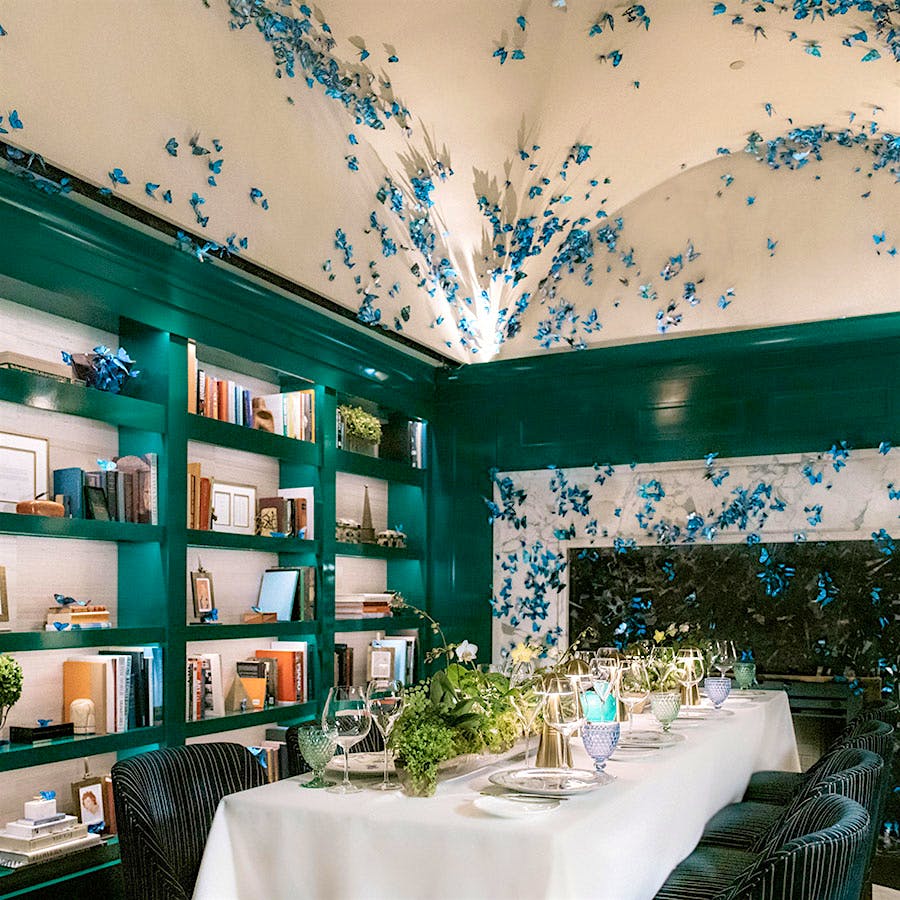 Private dining room at Atlas restaurant in Atlanta, with hundreds of blue butterfly decorations covering the vaulted