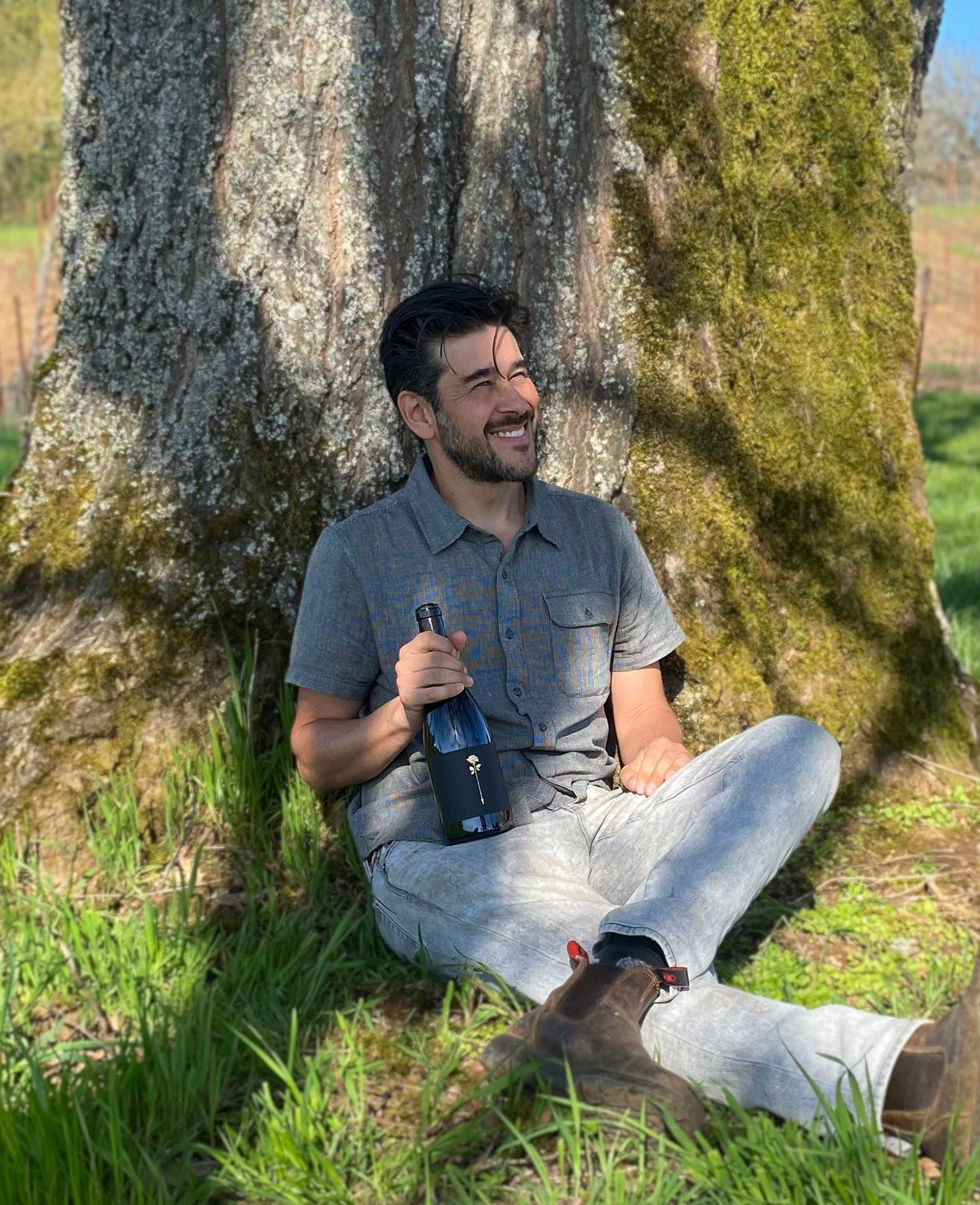 Felipe Ramirez, winemaker at Rose & Arrow Estate, enjoys a moment with his Touchstone Pinot Noir.