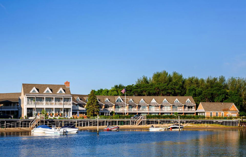 Faraway Sag Harbor: The waterfront property and docked boats, hinting at its serious upgrade.