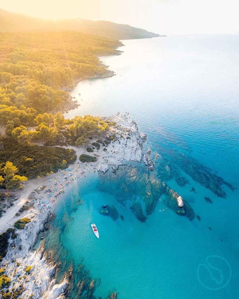 Sithonia, Halkidiki: A stunning aerial view of the peninsula's turquoise waters and forested coastline, perfect for Porto Carras.