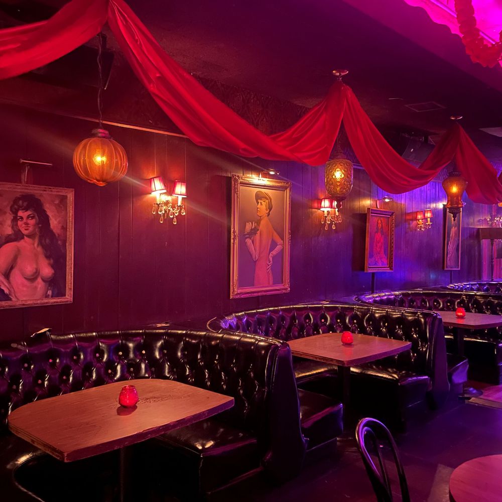 Bar B&F: The Sister Venue features striking red drapes draped across the ceiling.