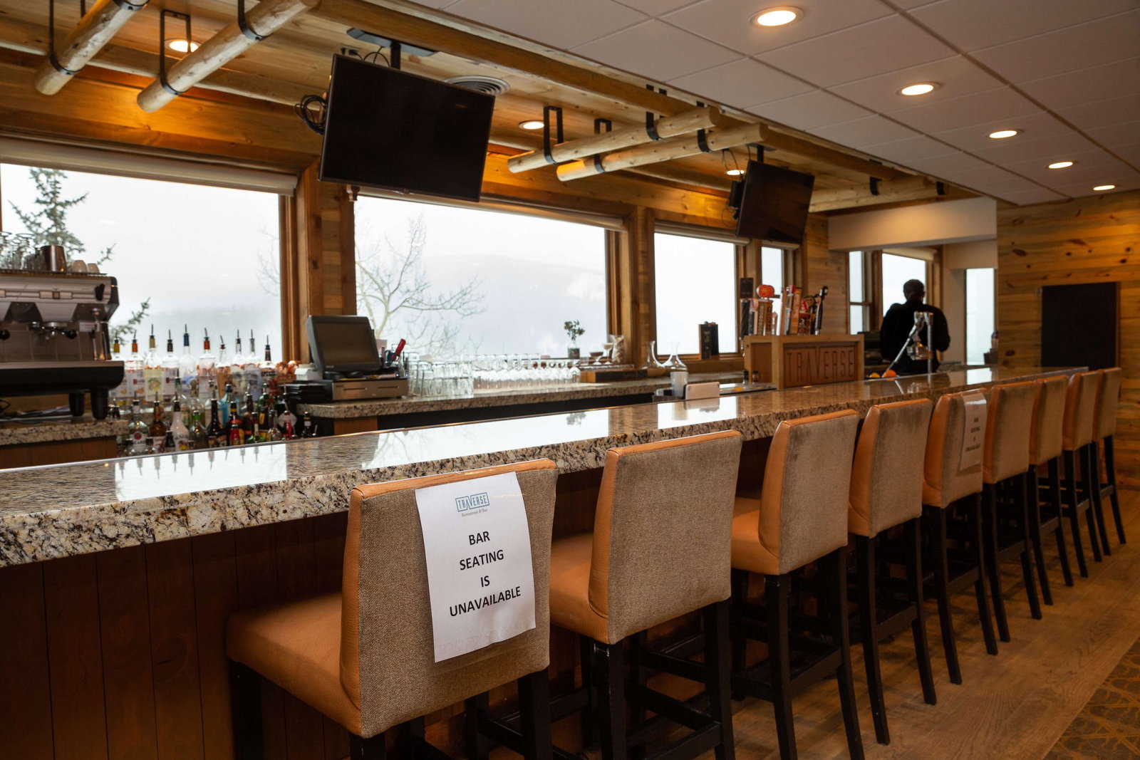 Awards and Guest Feedback, a sign on a stool indicates bar seating is unavailable.