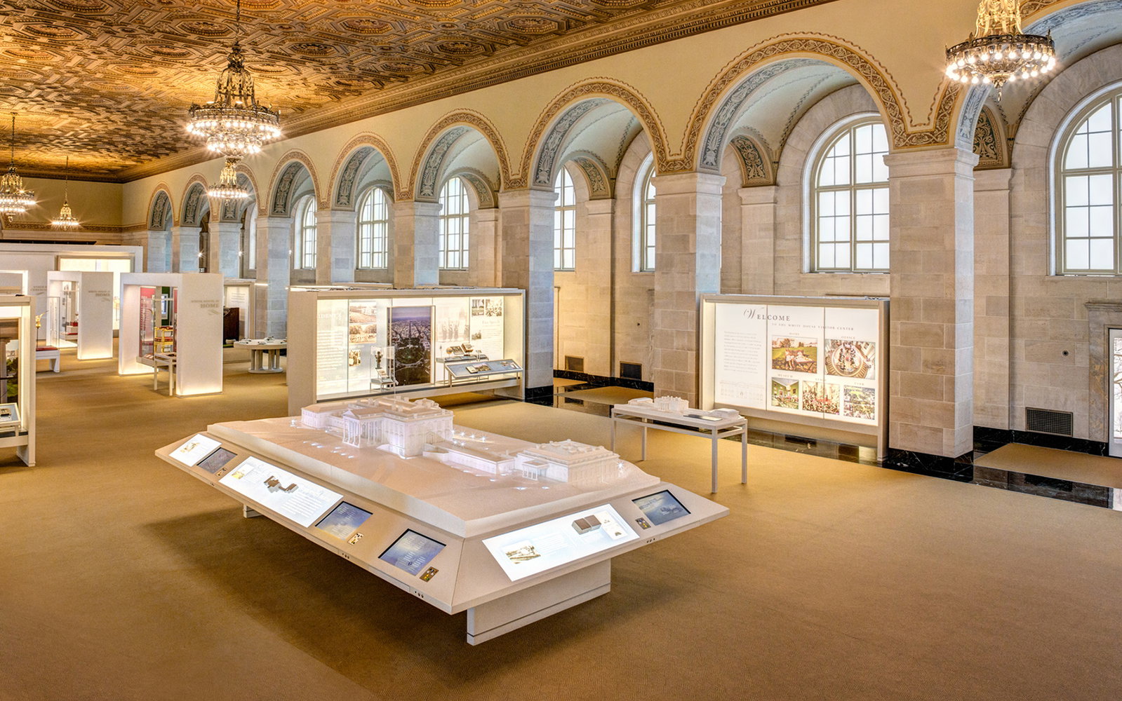 Visitor Information displays a prominent architectural model surrounded by interactive screens.