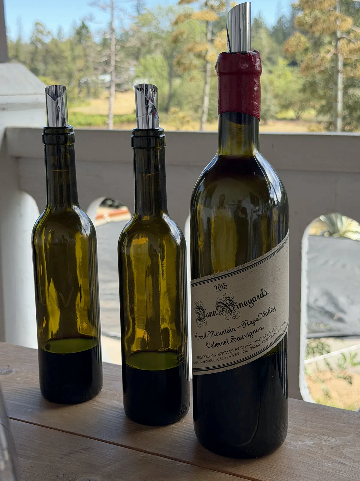 Two 2022 Dunn Cabernets beside a red-waxed 2015 Howell Mountain Cabernet