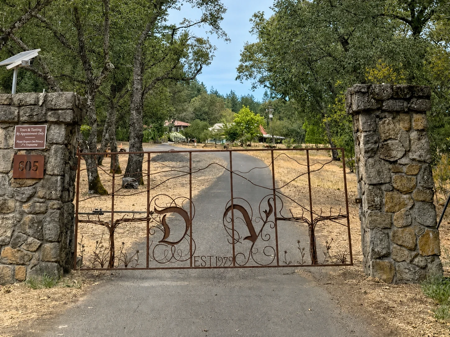 Alex Dunn's wrought-iron Dunn Vineyards entrance gate between stone pillars on Howell Mountain