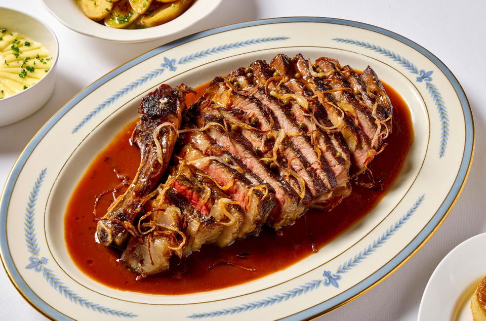 Elder's Berkshire pork rib chop with nihari gravy and caramelized onions.