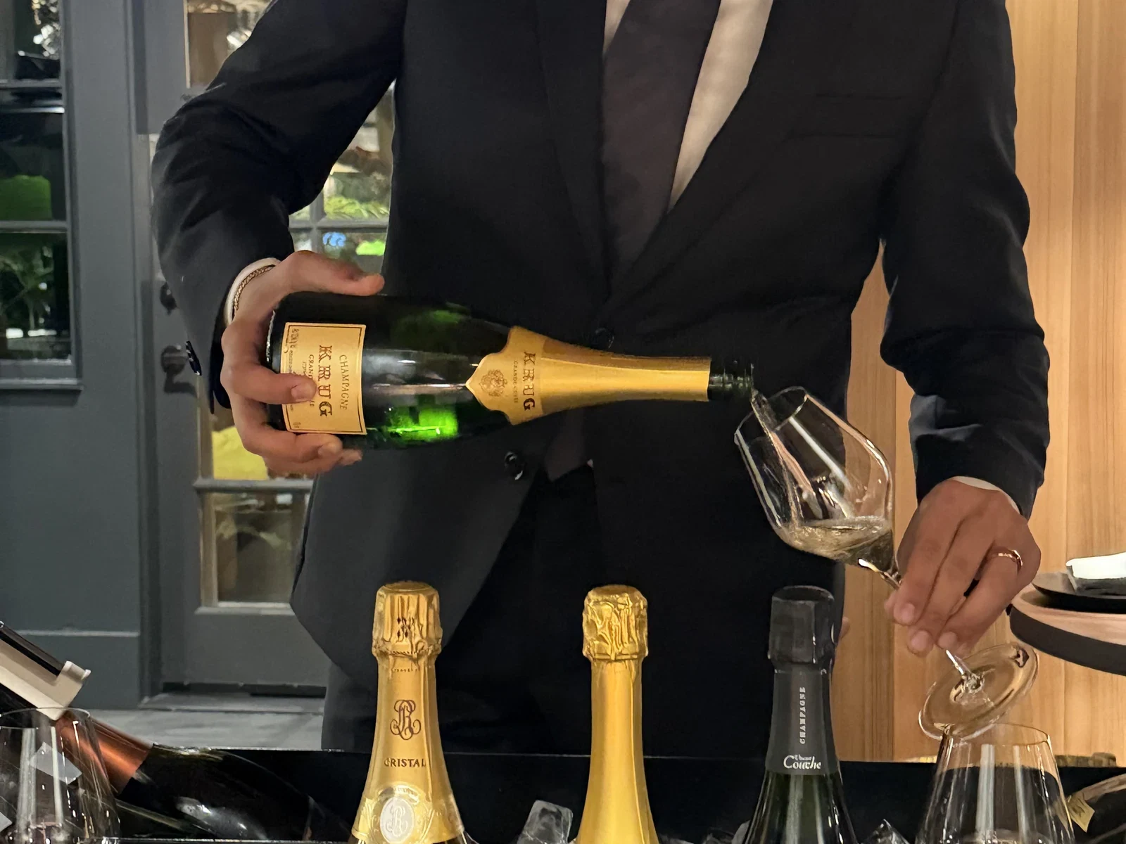 Champagne poured tableside from the Enclos cart during the first visit