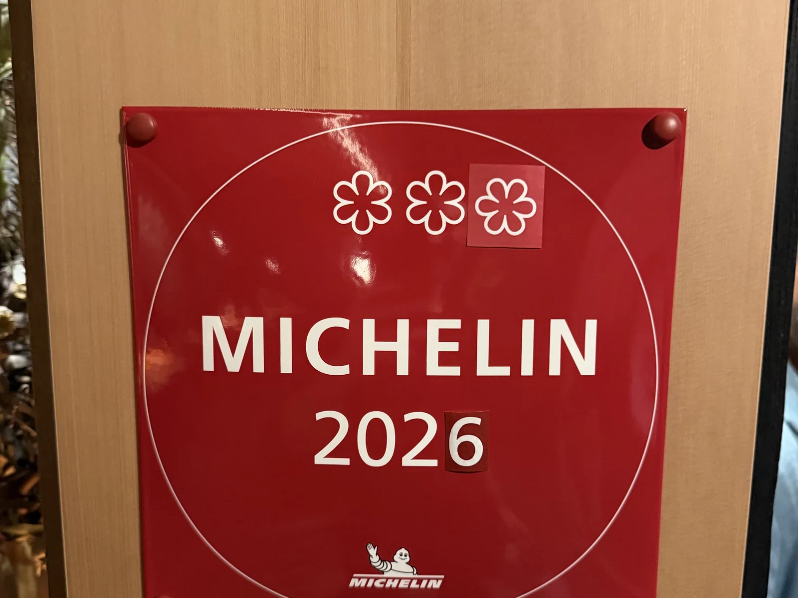 Red Michelin 2026 plaque with three stars inside Enclos in Sonoma