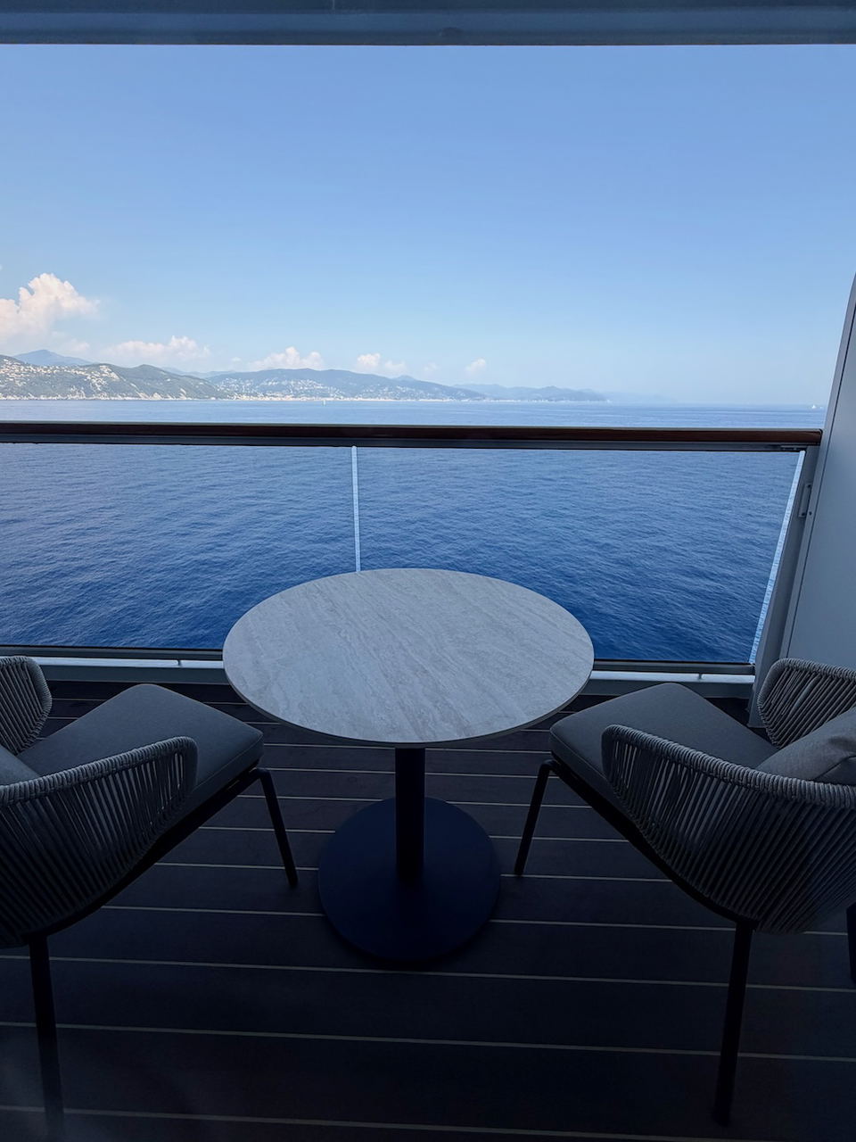 EXPLORA III offers a private balcony with modern furnishings and expansive ocean views.