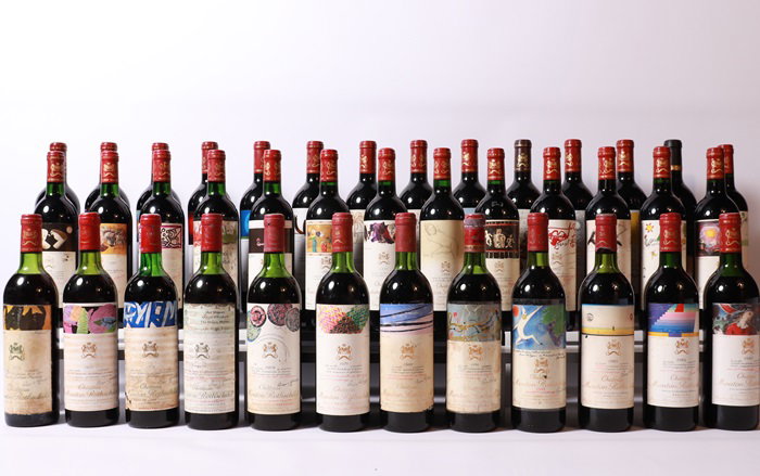 Château Mouton Rothschild bottles, a vertical collection, showcase distinctive artist-illustrated labels.