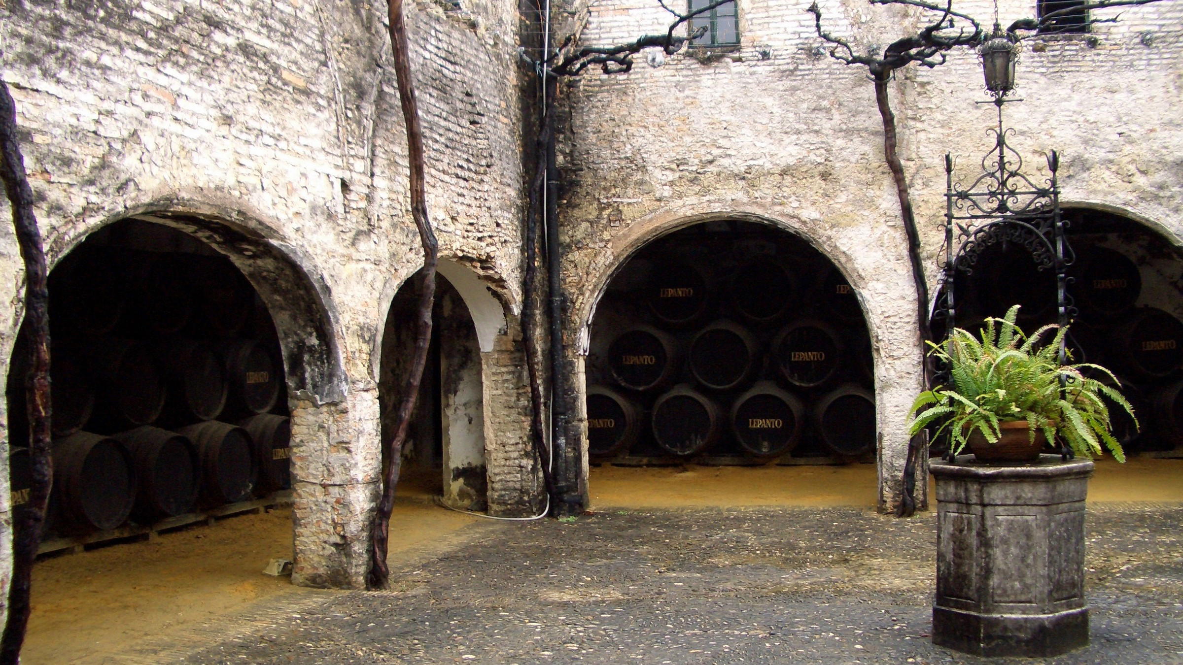 Arched bays of stacked sherry butts at the González Byass bodega in Jerez de la Frontera