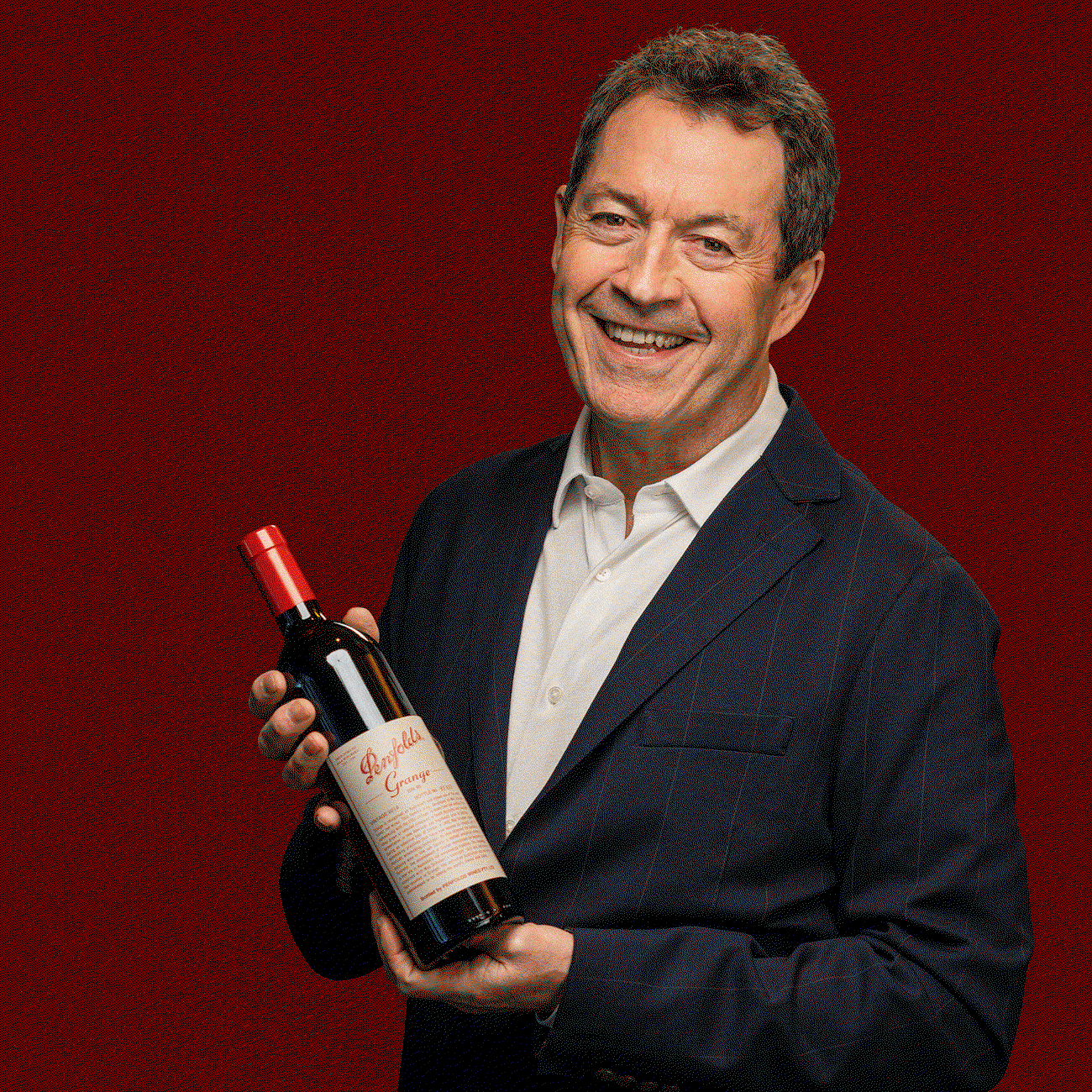 Peter Gago with a bottle of Penfolds Grange.