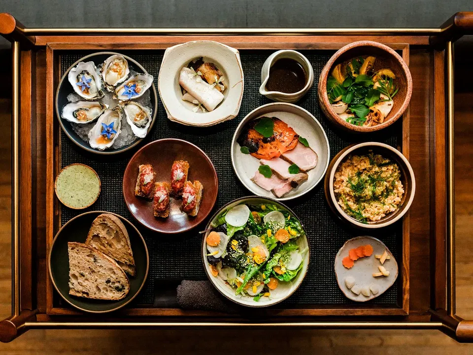 A wide selection of coastal tasting-menu dishes arranged at Harbor House restaurant