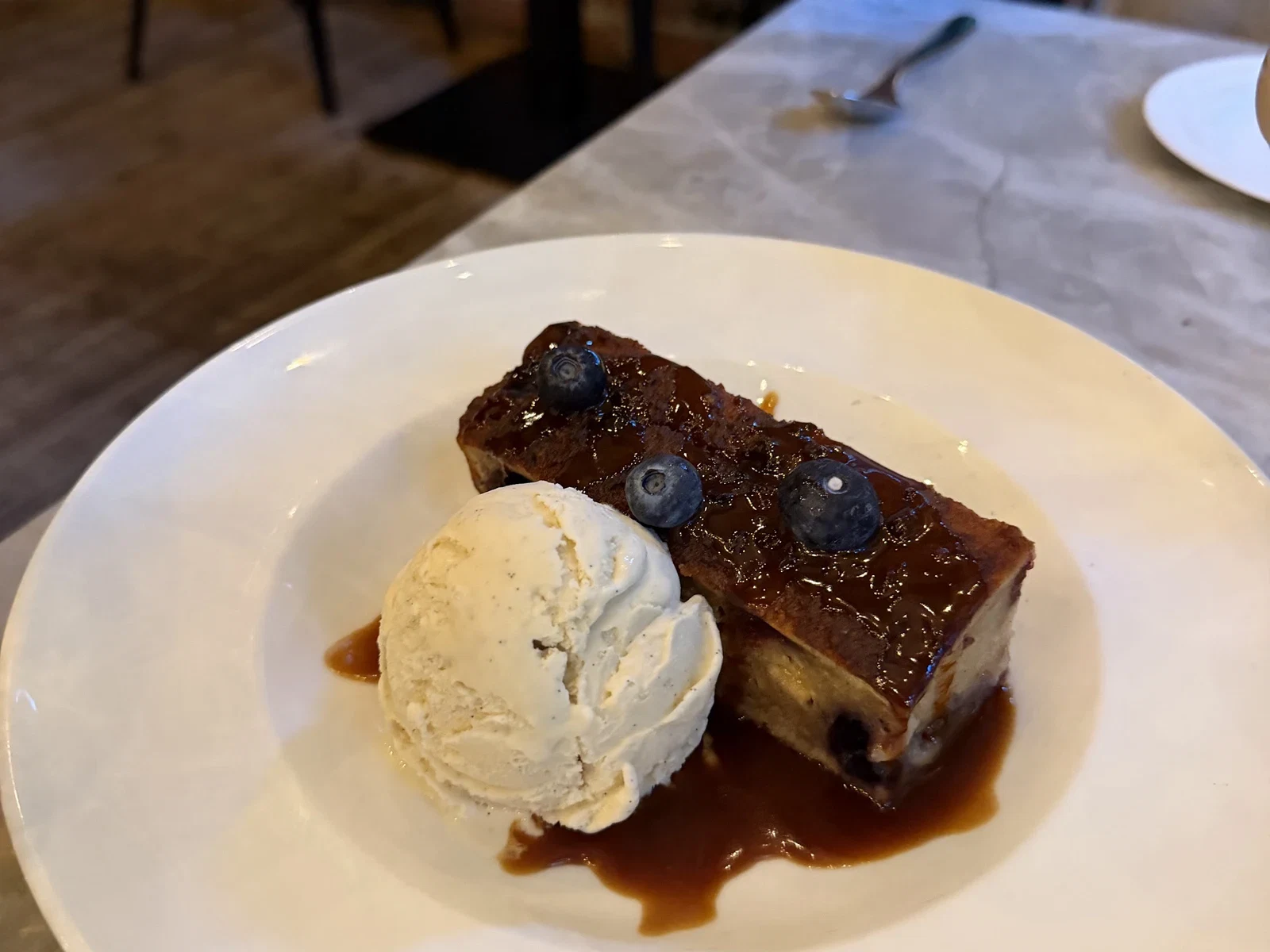 Warm Parker House roll bread pudding with ice cream at Harvest Table