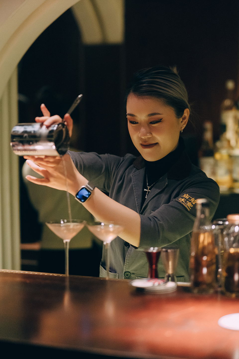 Hope & Sesame Guangzhou's Lola Lau crafts cocktails, a testament to the bar's acclaimed seven-year journey.