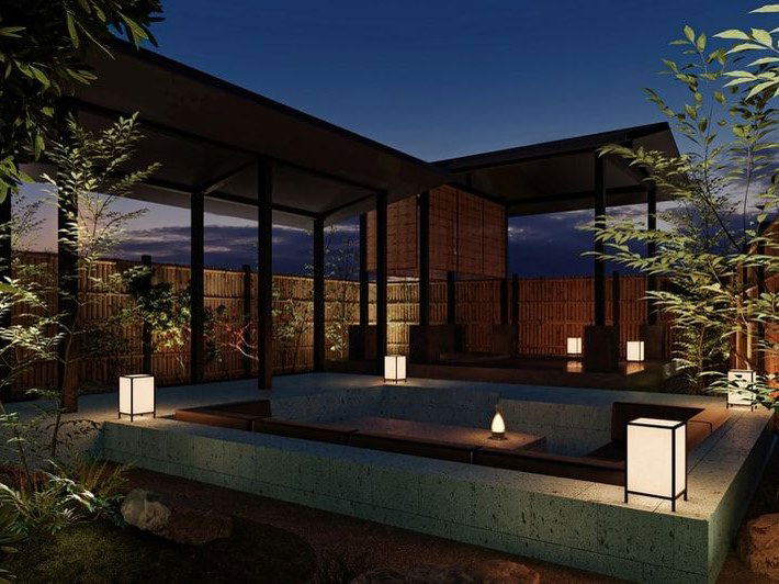 Hotel Fork & Knife Miyajima's serene courtyard with an outdoor onsen bath and shoji lanterns under the night sky.