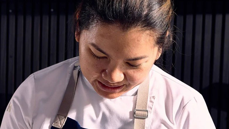 Chef Benchawan Jabthong Painter meticulously plates a dish, showcasing the artistry behind Houston's newest culinary ventures.
