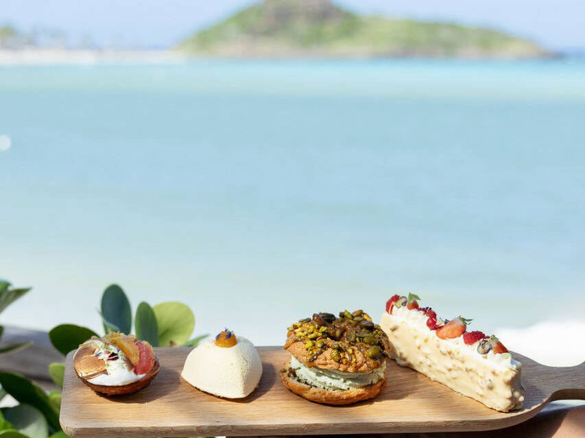 Amis St Barth: Indulge in exquisite pastries with a stunning turquoise backdrop.