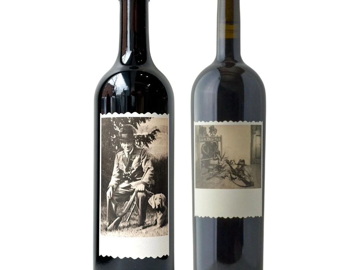 Two wine bottles with black and white photographic labels.