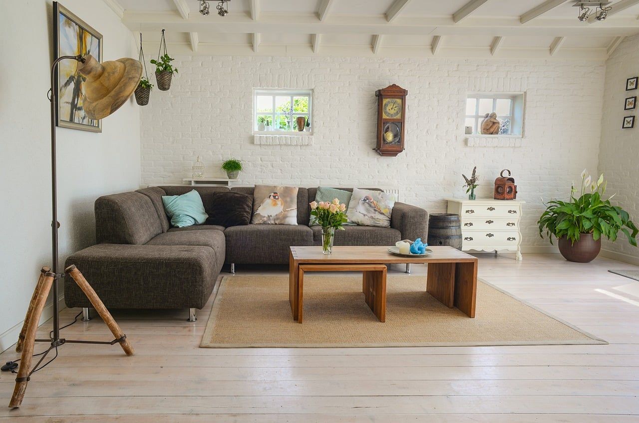 Key Statistics, featuring a bright white brick wall that adds texture and character to the room.
