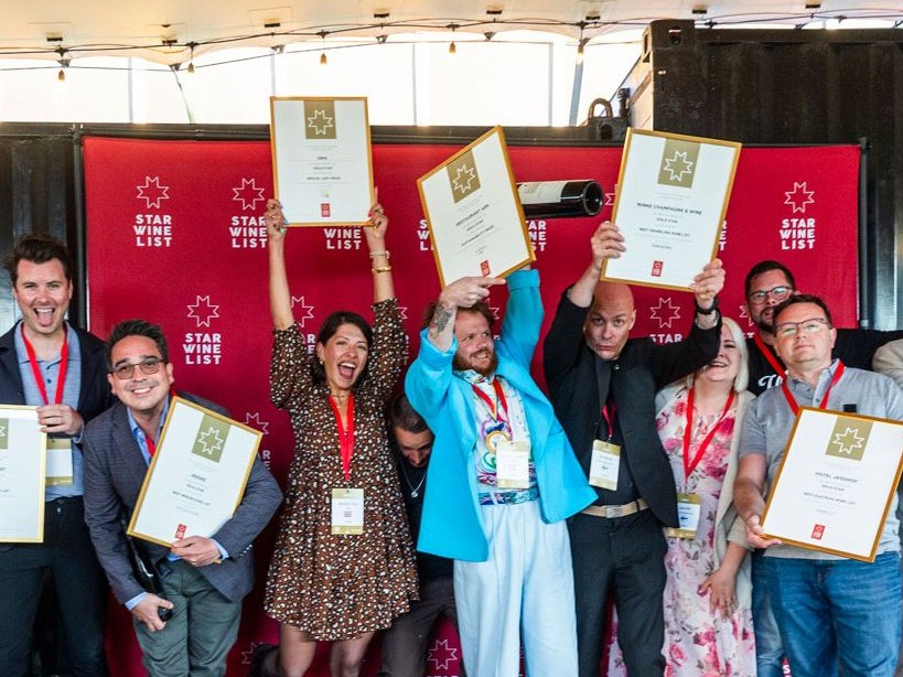 Inddee's Thanakorn 'Jay' Bottorff celebrates with fellow recipients at the Star Wine List Global Final.