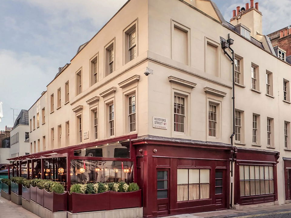 5 Hertford Street's Georgian townhouse on Hertford Street, Mayfair, with its discreet front door and outdoor terrace.