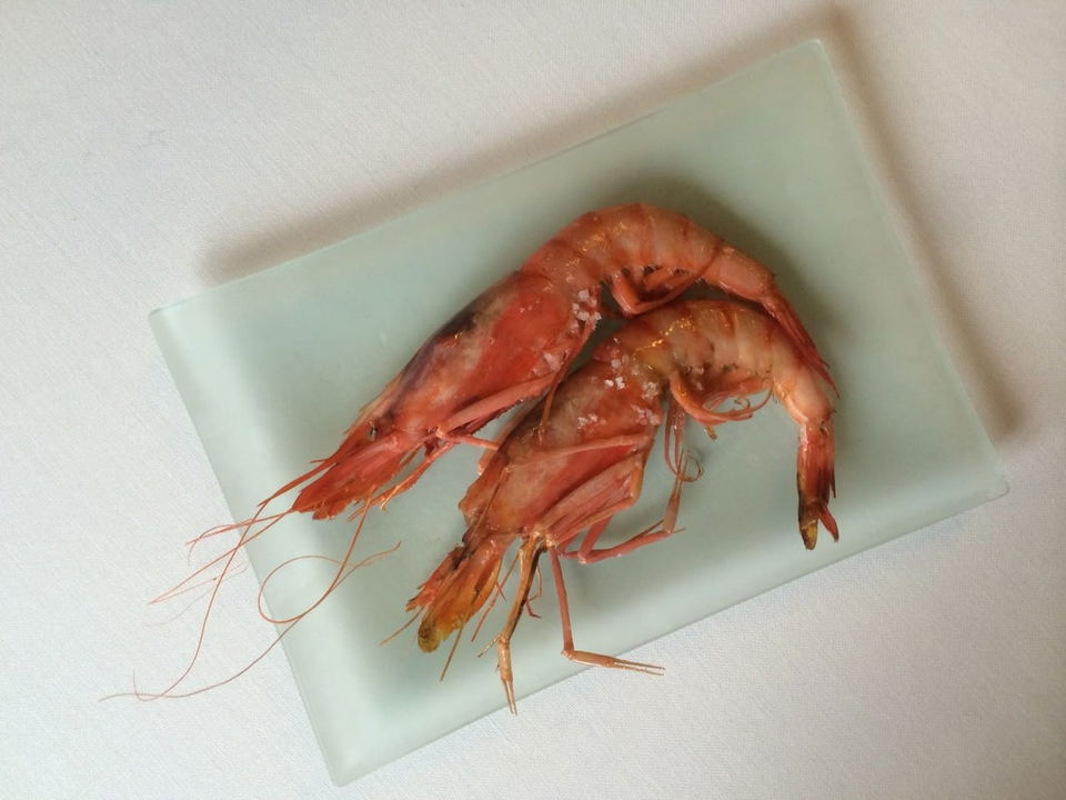 Asador Etxebarri's signature prawns, simply plated and ready to enjoy.