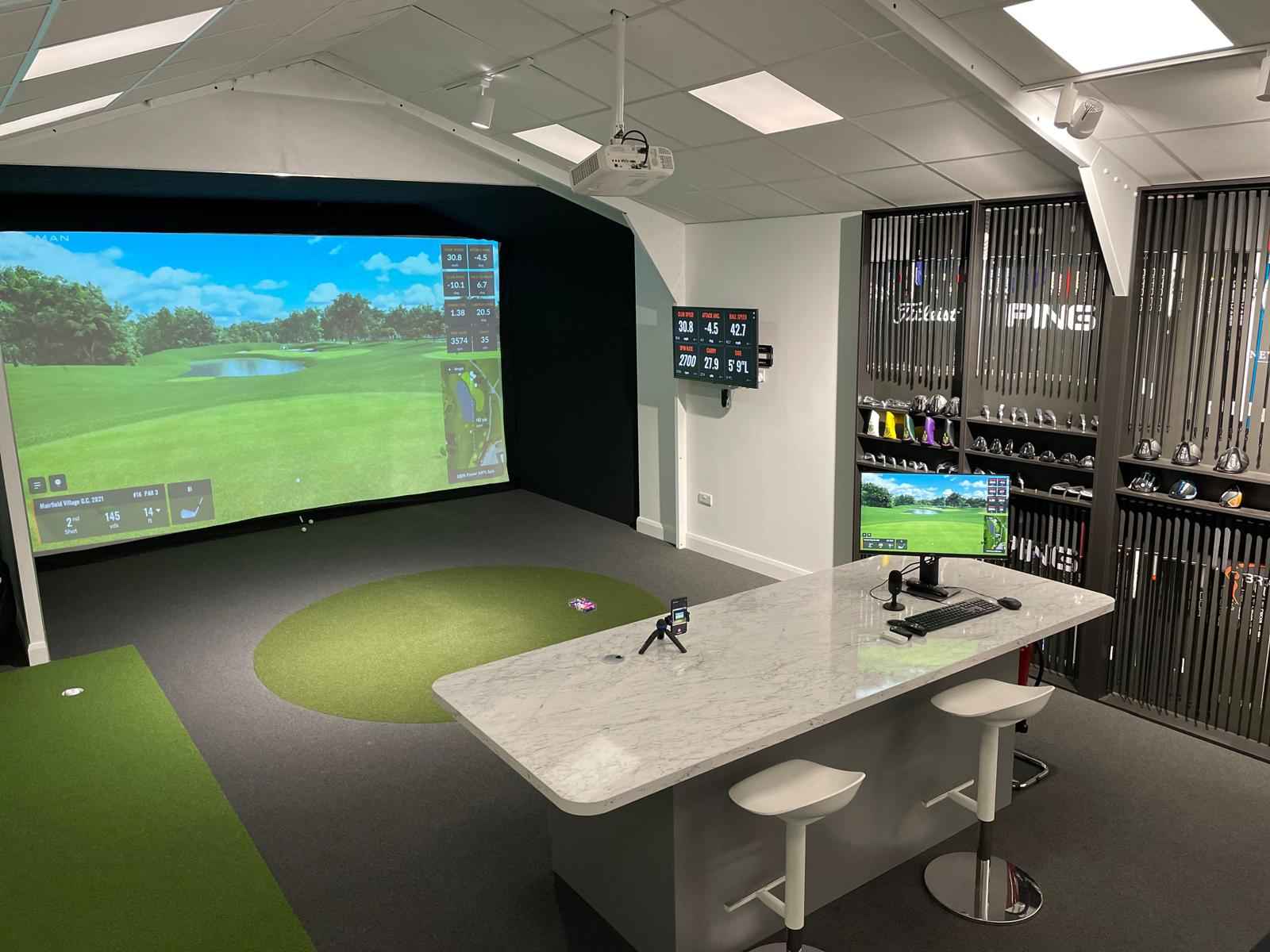 The Estate's Future and Visiting Information features a wide golf simulator screen displaying a vibrant green course.