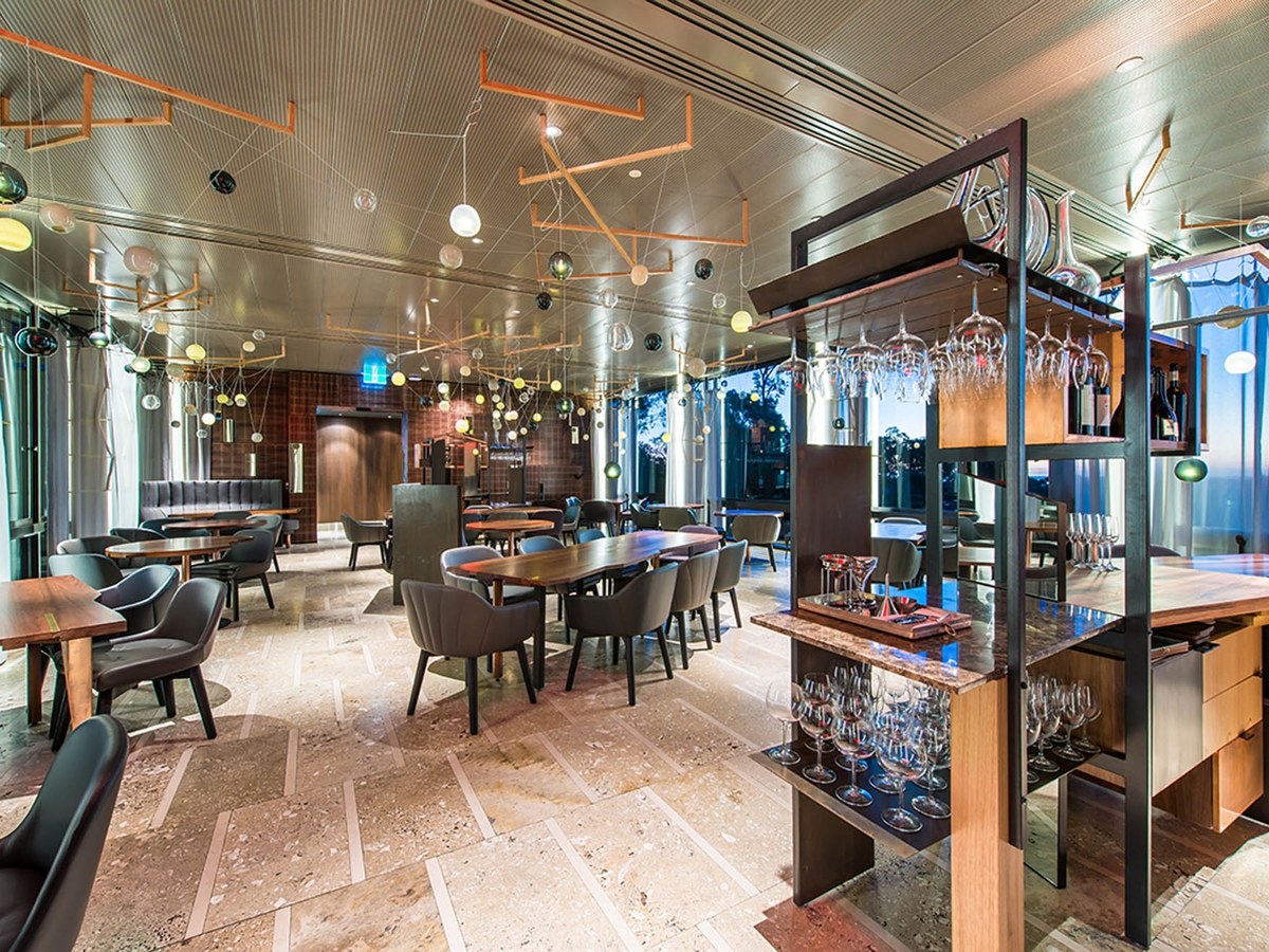 The Magill Estate dining room, with Penfolds bottles on display.