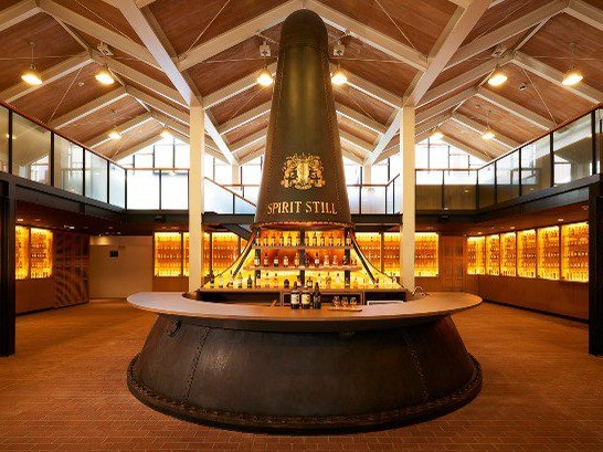 Suntory Yamazaki Distillery's visitor center features a repurposed spirit still and a whisky bottle library.