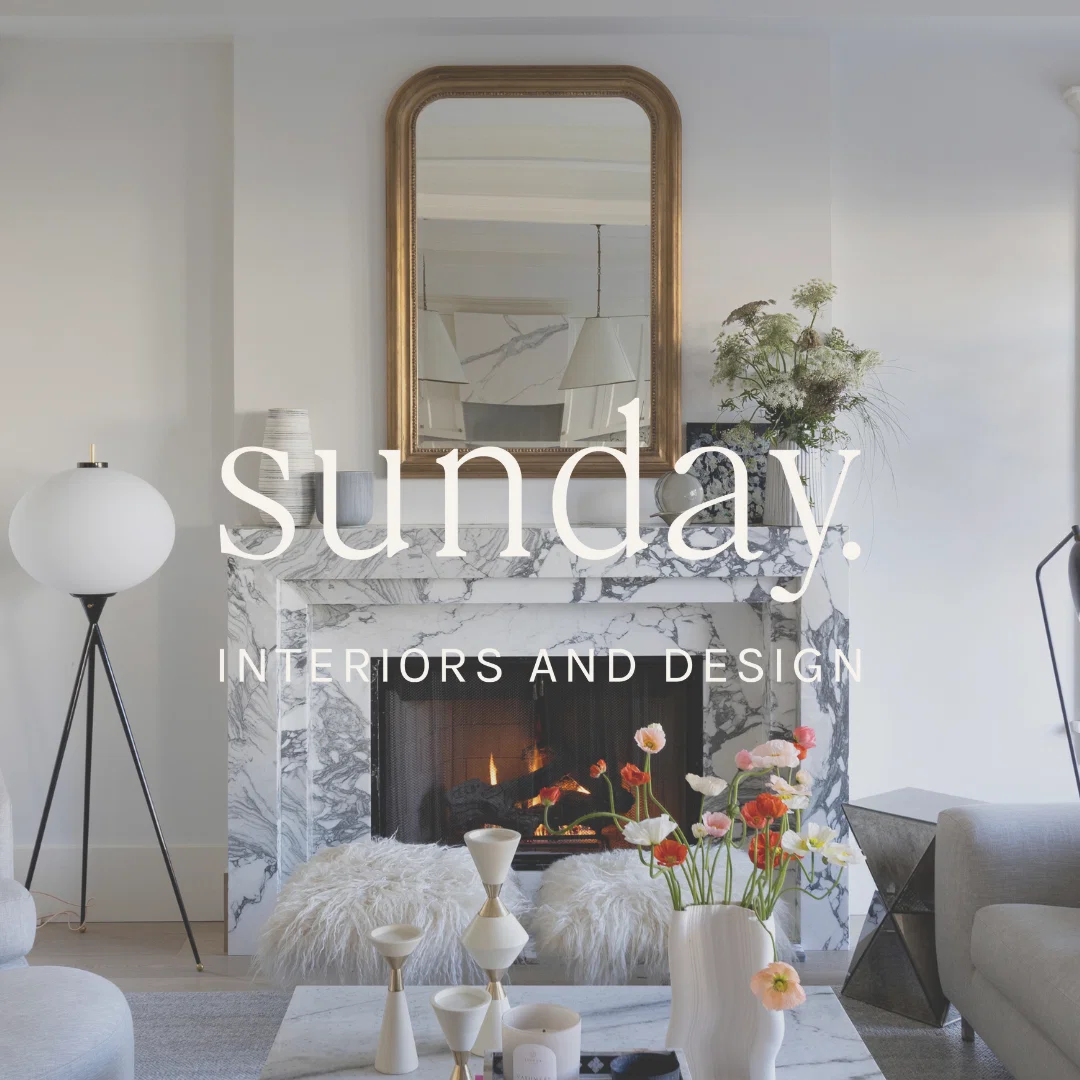 Sunday, a cozy fire glows within the elegant marble fireplace.