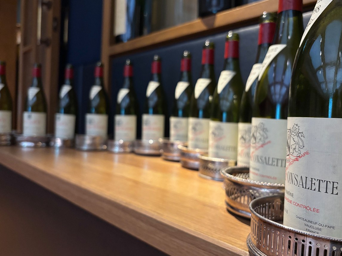 FONSALETTE bottles line a wooden shelf, a glimpse into the Rhône Valley's exclusive cellars.